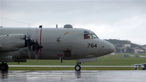 An Orion patrol craft departs from Kadena Air Base in Okinawa, Japan, to aid in the search efforts for the missing Malaysian airlines flight MH370. Photo- AP An Orion patrol craft departs from Kadena Air Base in Okinawa, Japan, to aid in the search efforts for the missing Malaysian airlines flight MH370. Photo- AP
